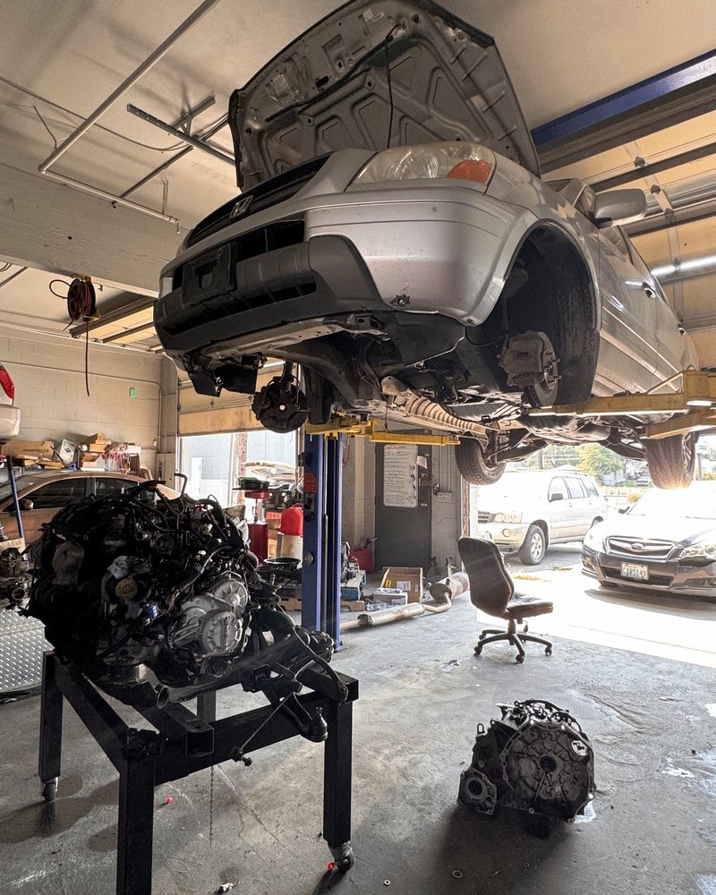 Honda Pilot on a lift during a transmission swap at Farrell's Automotive